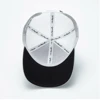 Image of a gray cap with white mesh back and white Sea Ray logo on front