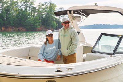 Image of a blue crewneck with white Sea Ray logo