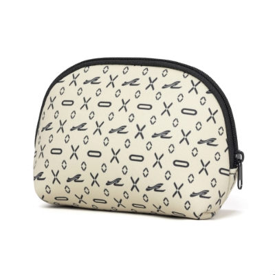 A cream-colored, half-moon shaped cosmetic bag with a black zipper. The bag has a black and white pattern of the Nautica logo and small geometric shapes.