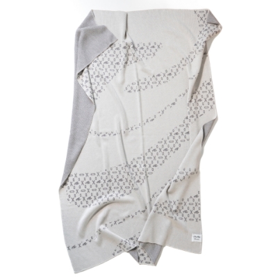 Image of folded Sunbrella X SeaRay Silhouette Knit Throw on white background