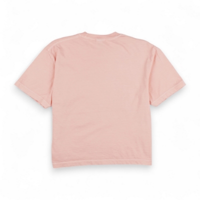 Women's Splash Tee - Peach Image of the Peach Women's Splash Tee with the Sea Ray logo and a graphic of a wave on the front. Below the graphic, the phrase "EVERY MOMENT PERFECTLY CRAFTED" is printed in small lettering