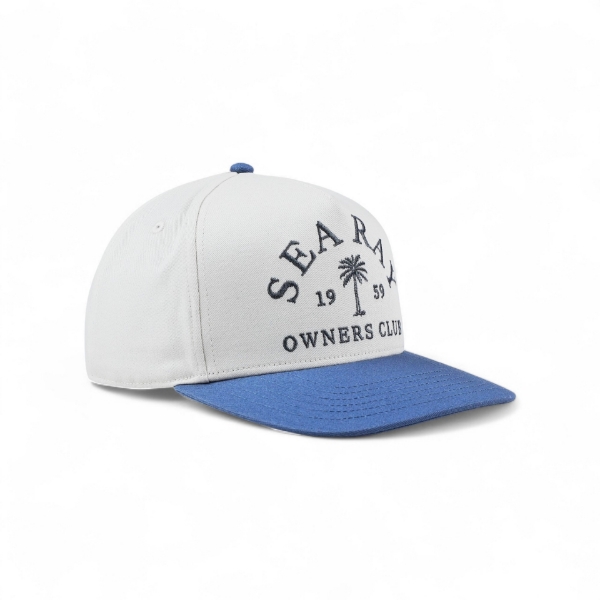 White Sea Ray hat shown at a right‑side three‑quarter angle with a blue bill and “Sea Ray Owners Club 1959” embroidered graphic.