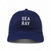 Front view of a navy blue Sea Ray hat with vertically stacked white embroidered “Sea Ray” lettering.