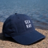 Angled Sea Ray Coastal Hat in front of water