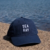 Sea Ray Coastal Hat in front of water