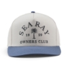 Front view of a white Sea Ray hat with a blue bill and embroidered “Sea Ray Owners Club 1959” logo with palm tree graphic.