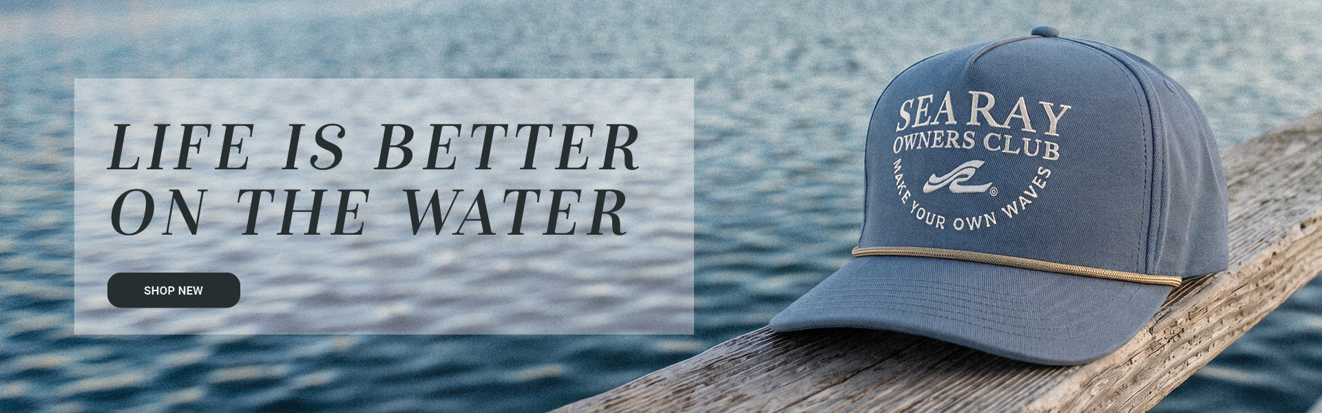 Sea Ray merchandise laying on dock with LIFE IS BETTER ON THE WATER SHOP NEW text and button overlaying